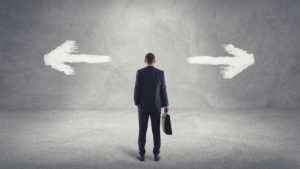 Business Man At A Crossroad